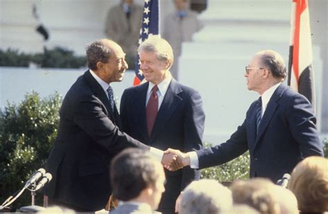 Anwar Sadat and Menachem Begin signing the Peace Treaty