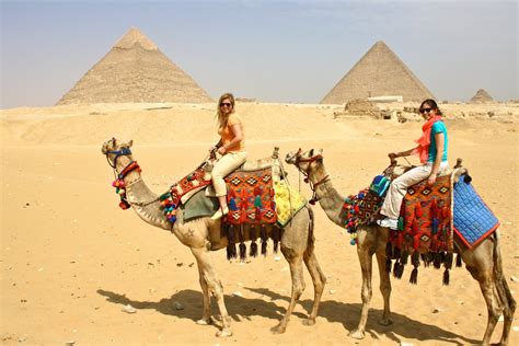 Riding camels at the pyramids of Giza
